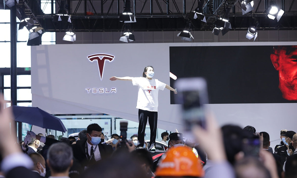 Court Begins for Tesla vs Woman Who Protested Atop Tesla Car at Auto Show