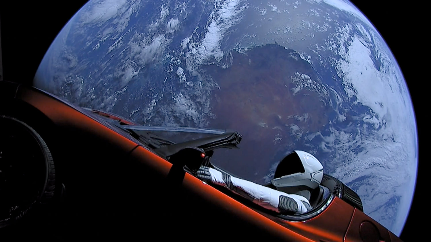 SpaceX's Starman cruising space in a Tesla makes a close approach to Mars