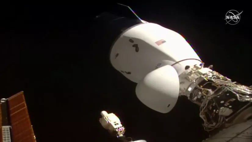 SpaceX's upgraded Dragon spacecraft docks to the Space Station carrying NASA cargo