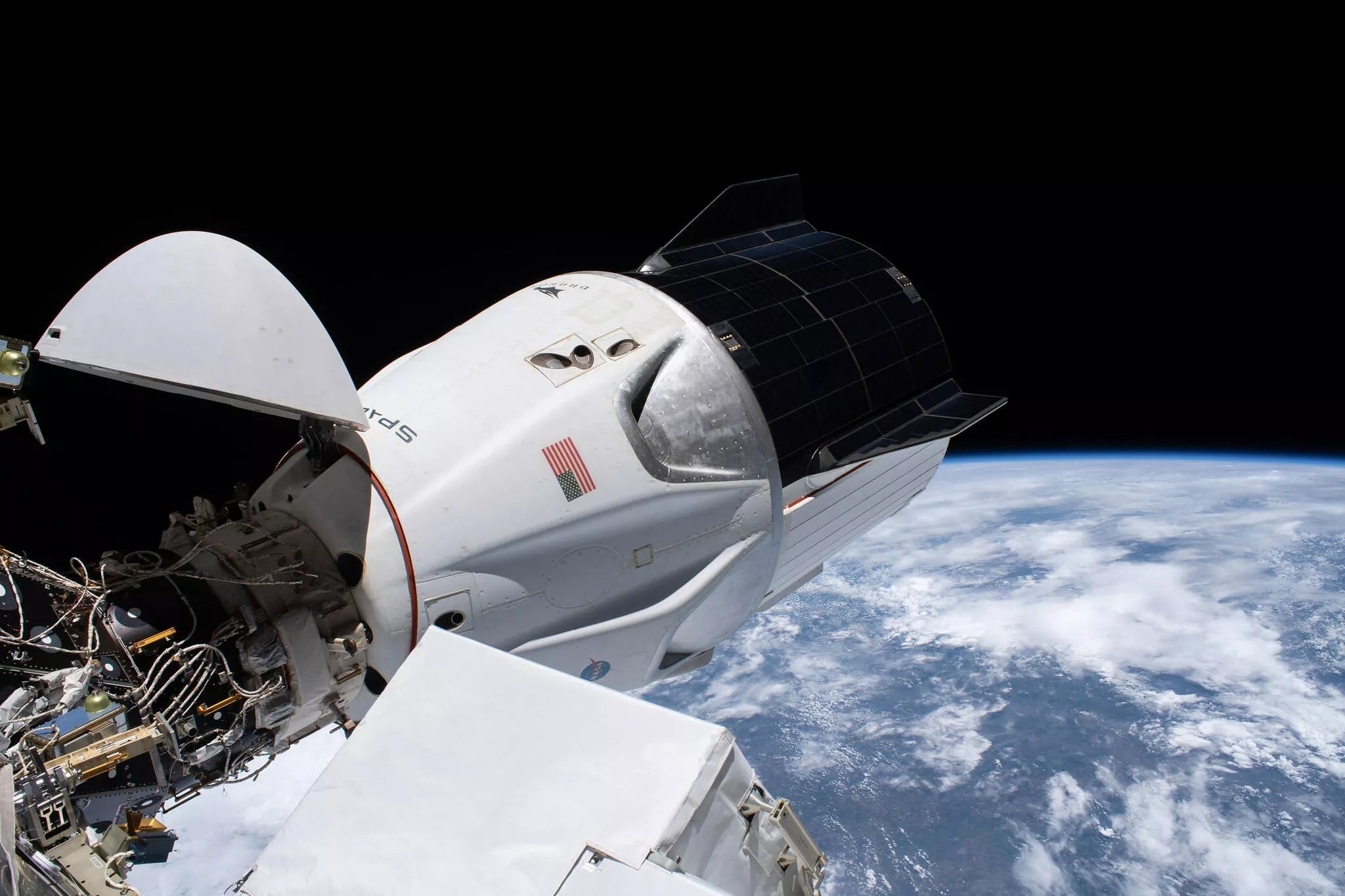 NASA Astronauts At The Space Station Will Undock & Relocate SpaceX Crew Dragon Resilience