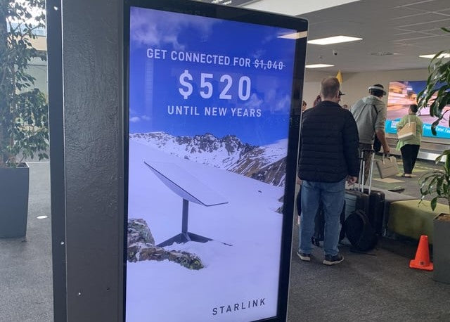 SpaceX displays a Starlink discount advertisement at a New Zealand Airport